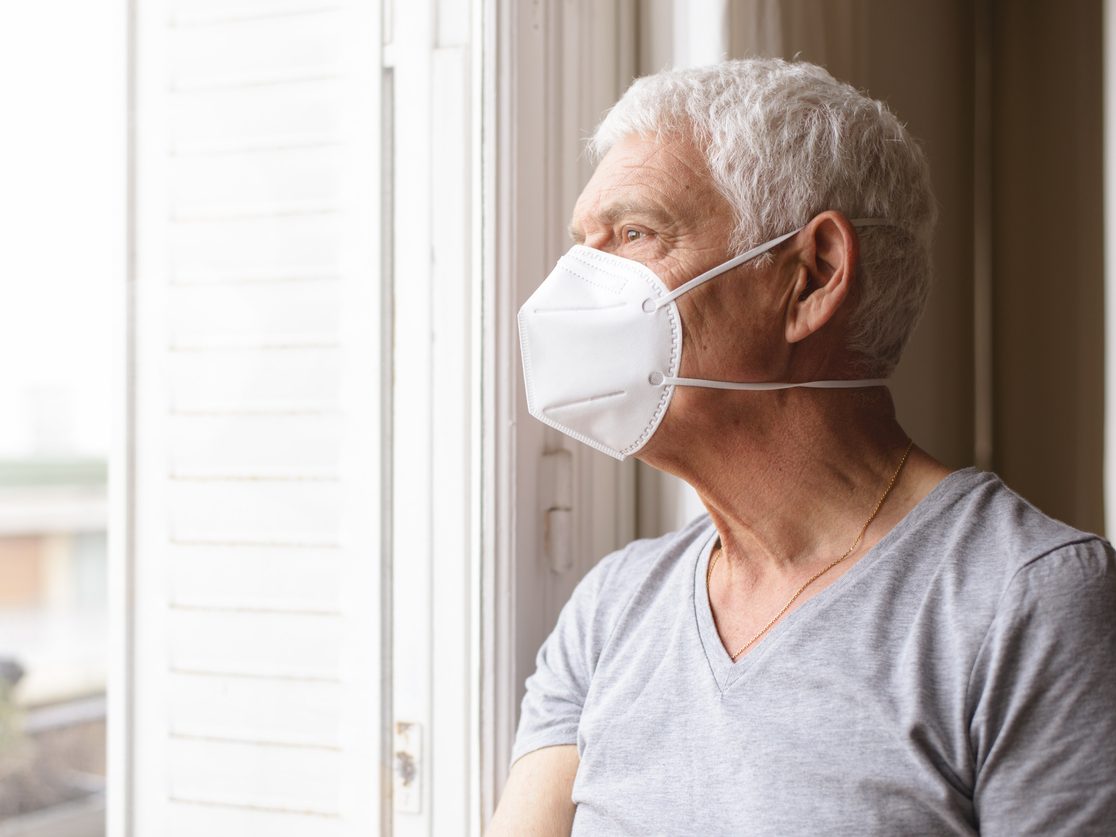 man wearing mask indoors