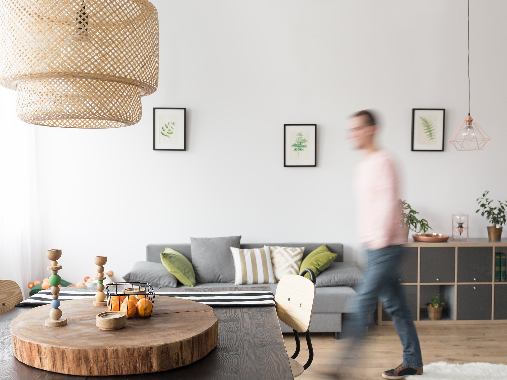 A well designed living room with a motion-blurred walking man