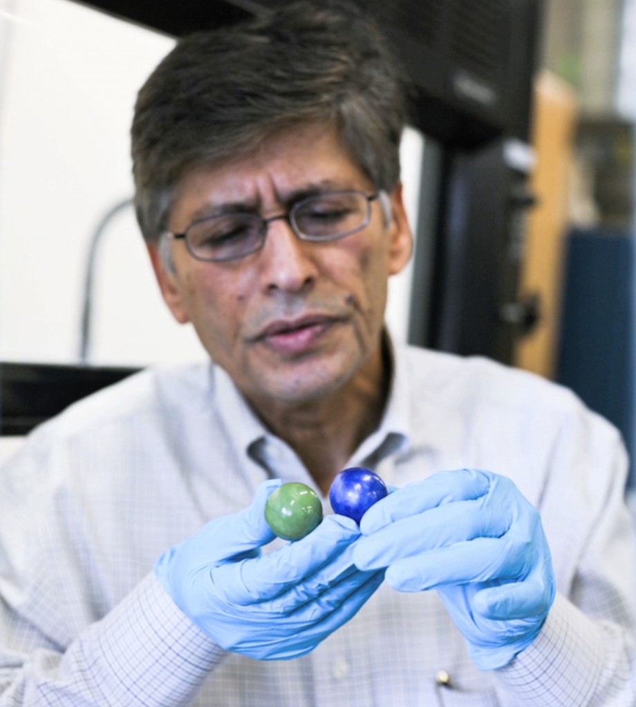 Dr. Yogi Goswami holding thermal salt balls in his laboratory at USF