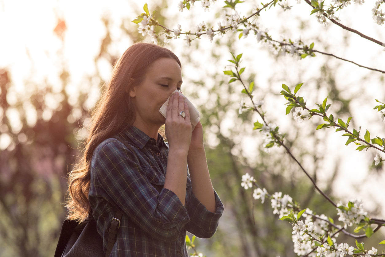 Woman having spring allergy symptoms