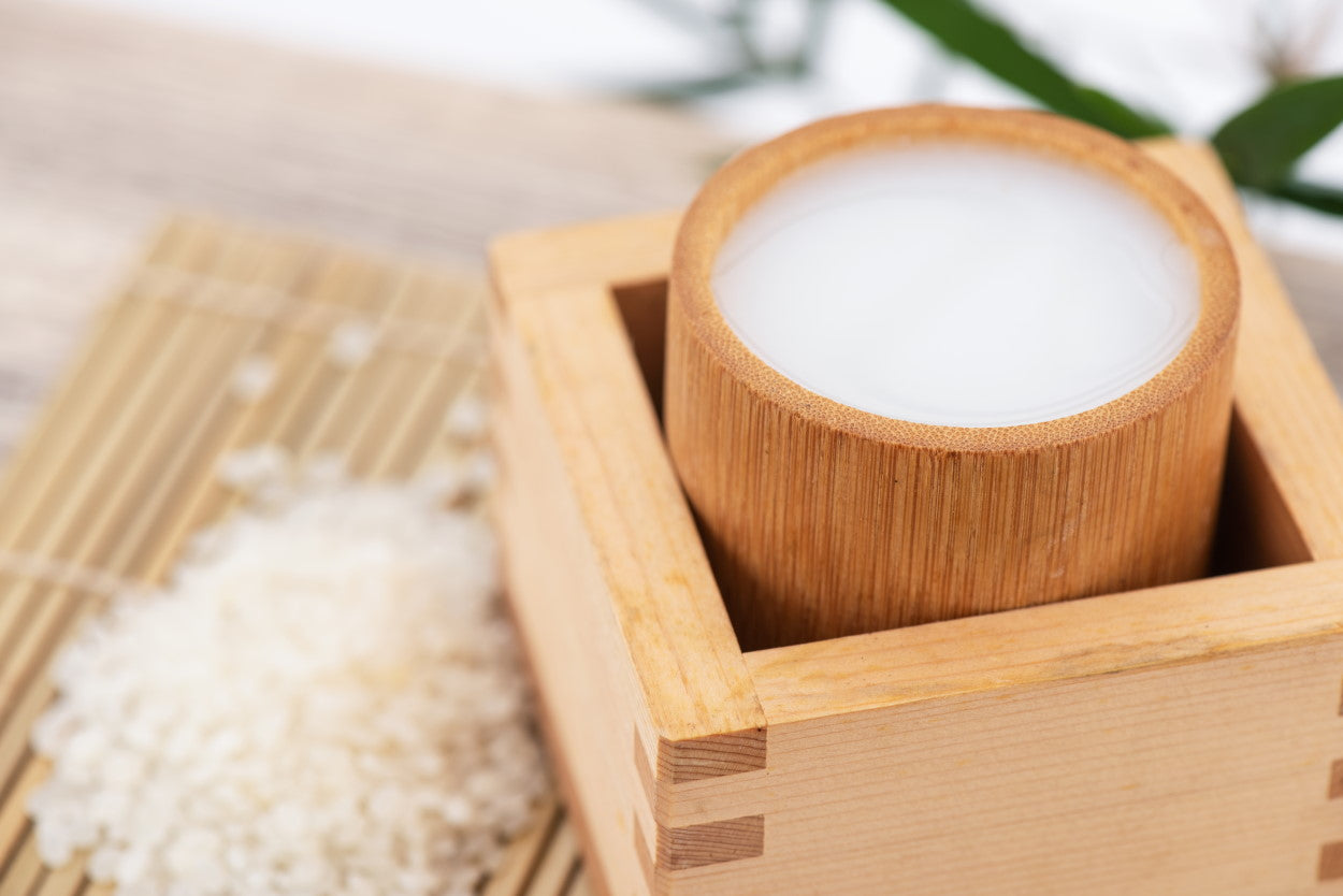 Rice and sake in a wooden cup