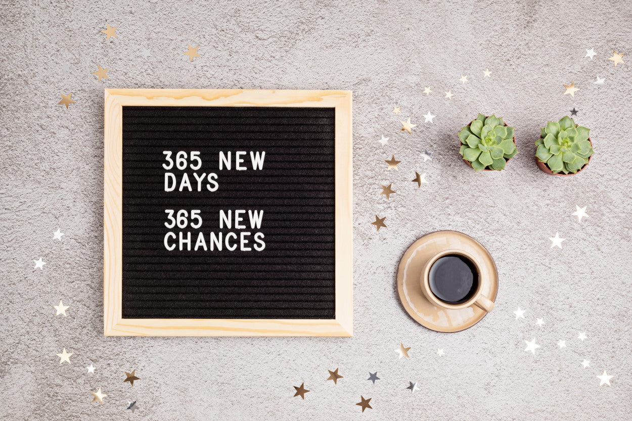 Felt board with letters spelling out "365 new days, 365 new chances"