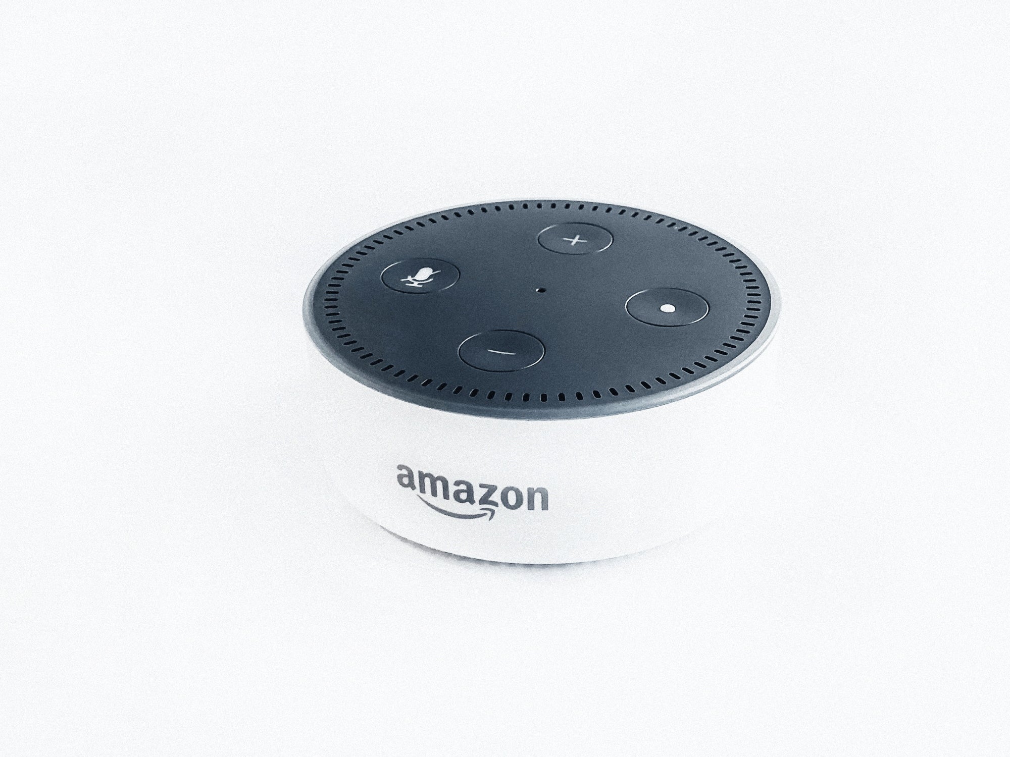 Amazon Echo Dot device on white background