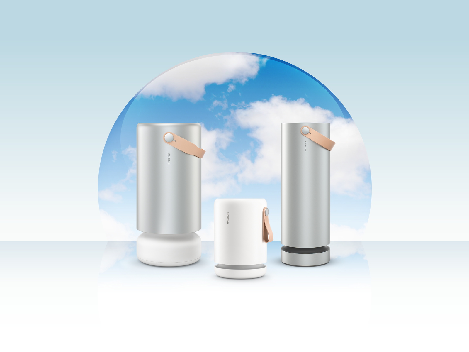 Three Molekule air purifiers with blue sky and clouds in the background