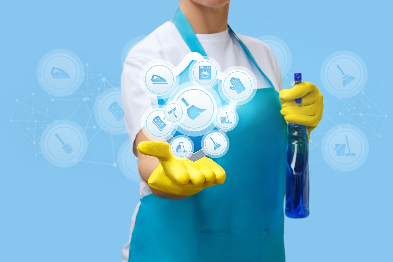 Cleaning professional in rubber gloves with symbols for cleaning safety