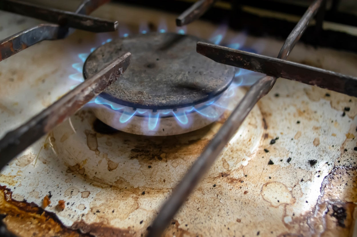 Close-up of a lit stove burner