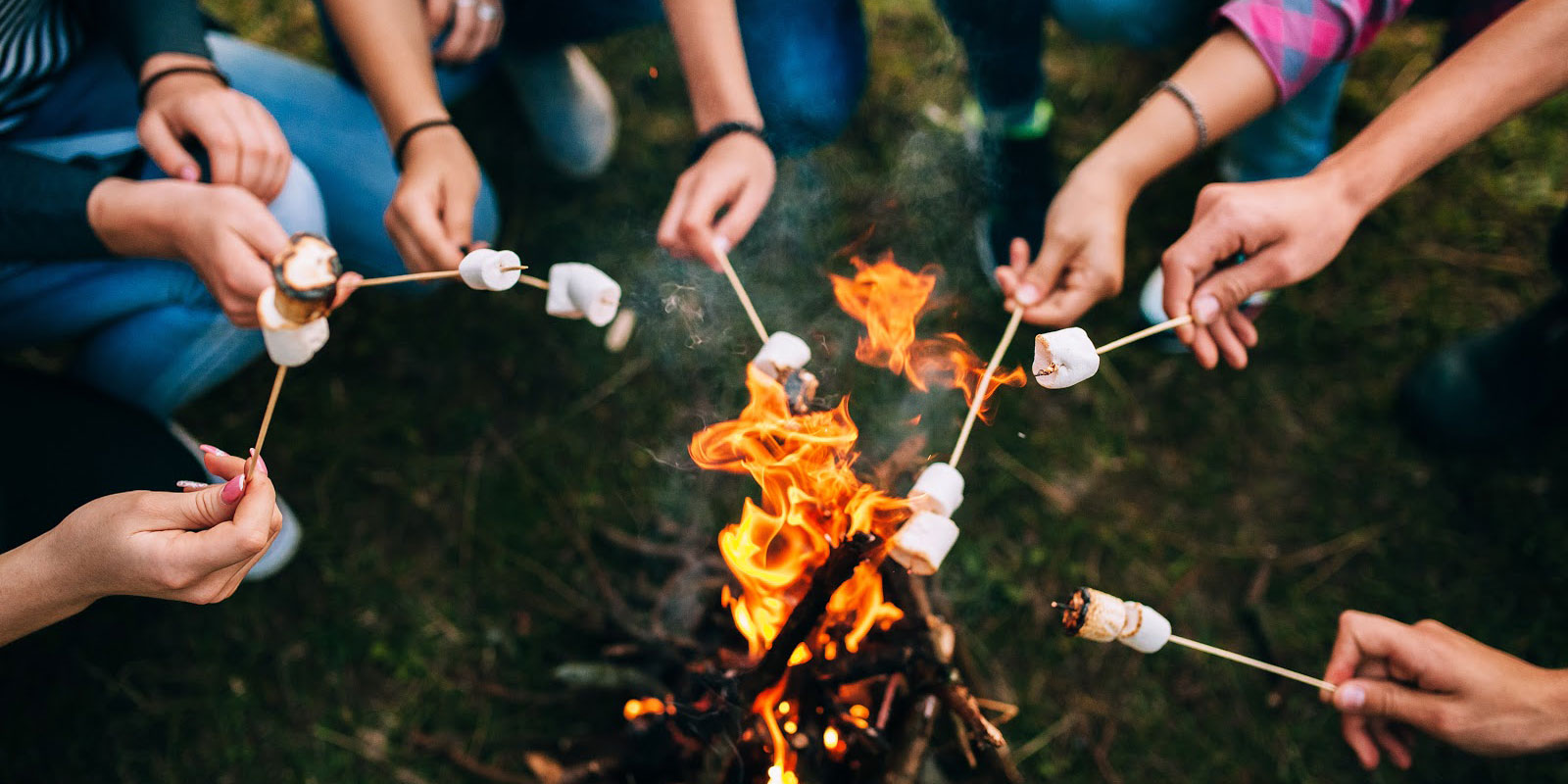 Spending time outdoors during summer allergies roasting marshmallows