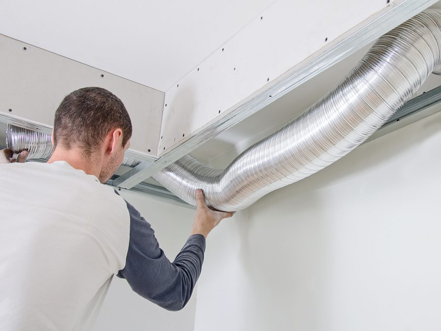 Man installing Whole Home Humidifier