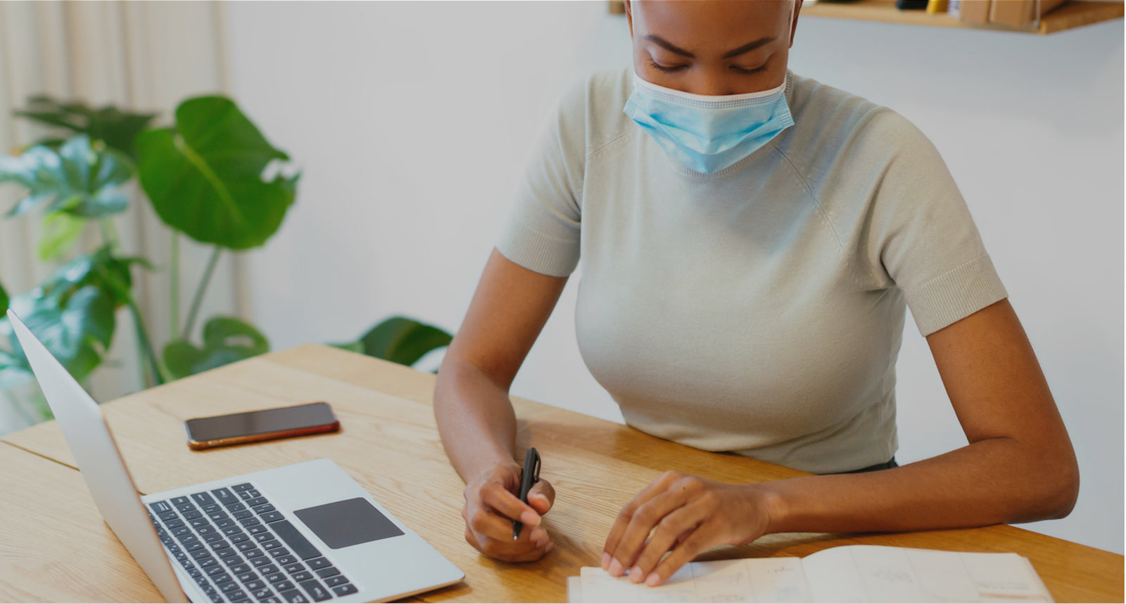 Female working in the office with a mask on
